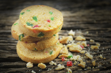 Mixed fruits cookies on old wooden background