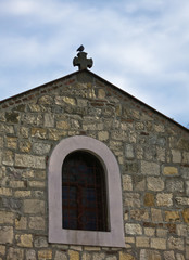 Pigeon sitting on a cross of a church at Kalemegdan fortress