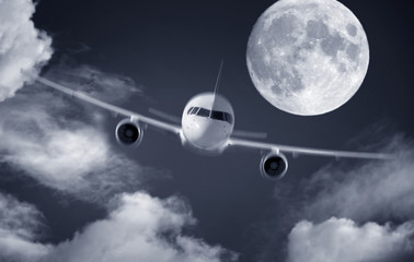 Fototapeta na wymiar airplane and a full moon
