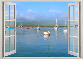 Open window view to blue sea with boats Mull Island, Scotland