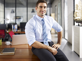 portrait of a caucasian businessman smiling in office