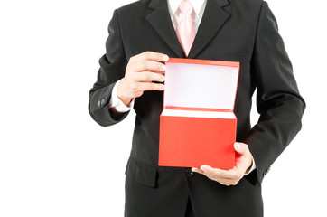 businessman holding red box