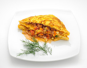 Omelette Thai style with vegetable filling isolated on white