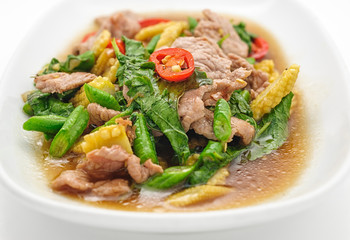 Pork stew with pineapple in sweet sauce isolated on white