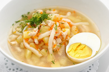 Noodles soup with egg isolated on white