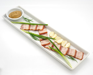 Ham with garlic and mustard isolated on white