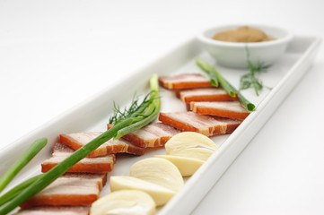 Ham with garlic and mustard isolated on white