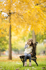 Little girl at the bench