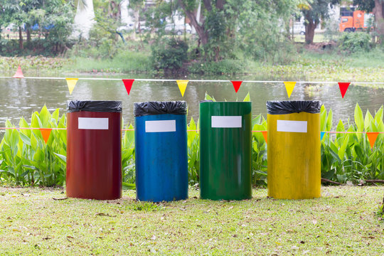 colorful of recycle bins in the garden