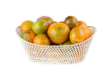 orange fruit in basket, isolated on white background