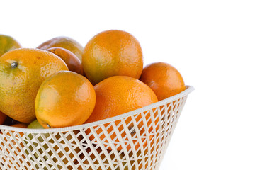 orange fruit in basket, isolated on white background