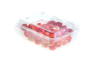 Fototapeta na wymiar red ripe strawberry in plastic box of packaging, isolated