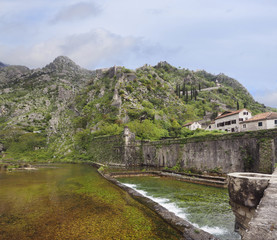 Fototapeta na wymiar Defensive Wall and River Outside of Kotor, Montenegro