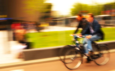Fototapeta na wymiar blur two bicycle with two men