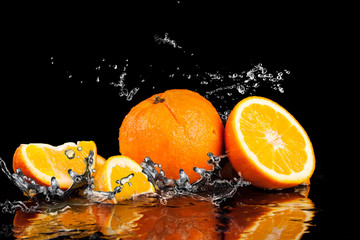 Orange fruits and Splashing water
