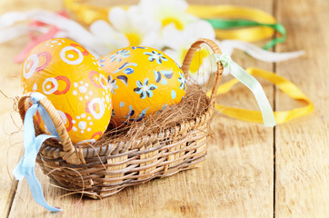 Easter eggs, basket, flowers