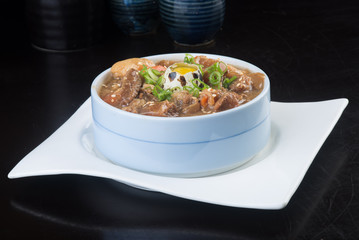 japanese cuisine. beef soup on the background