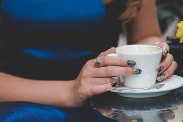 Hands with cup of coffee