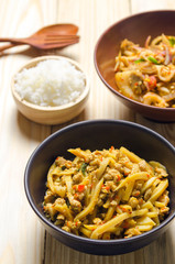 Thai spicy bamboo shoot salad on wooden table background
