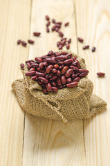 beans in sack on wood table