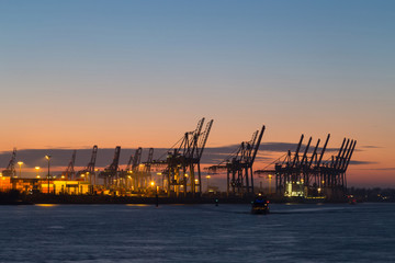 Fototapeta na wymiar Cargo terminal in Port of Hamburg at dusk, Germany