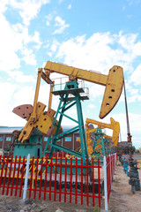 Golden yellow and orange Oil pump of crude oilwell rig
