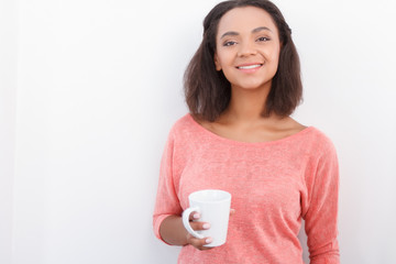 Pretty girl posing with cup