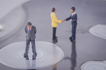 miniature business man thinking about business