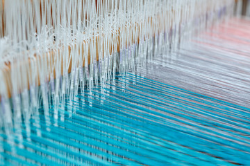 Colorful threads in a loom