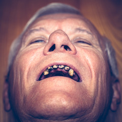Old man with ugly teeth