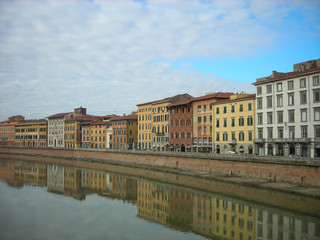 Fototapeta na wymiar Beautiful renaissance architecture of Pisa on the banks of river Arno on a sunny, tranquil morning. Italy, Tuscany.