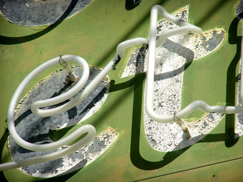 aged and worn vintage neon sign
