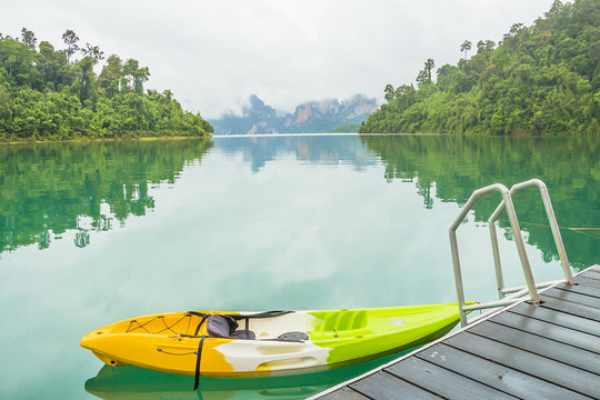 Lake and mountain landscape with kayak boat at Rajjabrabha Dam, Surat Thani Province, Thailand
