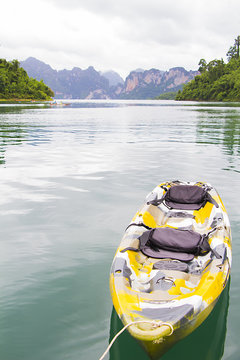 Lake and mountain landscape with kayak boat at Rajjabrabha Dam, Surat Thani Province, Thailand