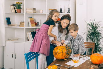 Happy family playing on Halloween night.