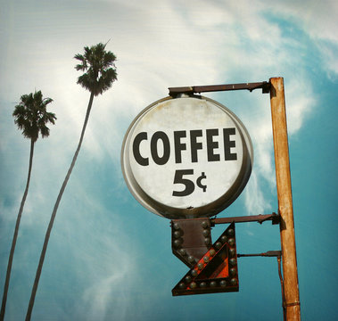aged and worn vintage photo of coffee five cents sign