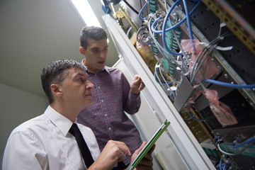 network engineers in server room