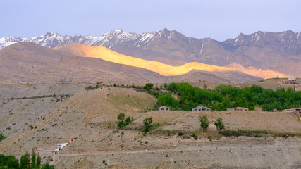 evening time,  light from the sun on the mountain behine  Kgril