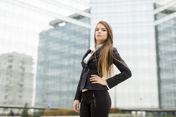 Business woman in front of office building