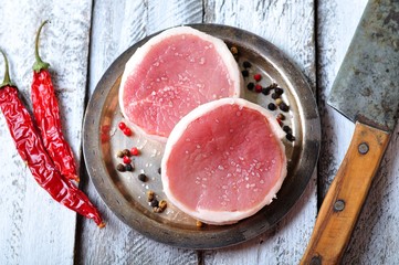 filet mignon chili peppers on a wooden table