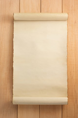 parchment scroll on wood