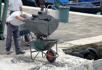 Concrete Pour into Wheelbarrow with Workmen