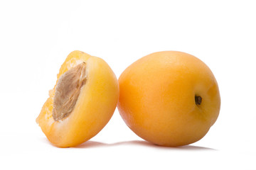 Ripe apricots on a white background