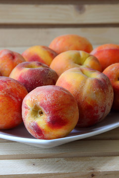 Ripe peaches on a plate..