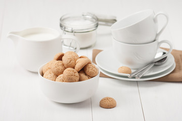 Amaretti Biscuits. Kitchenware. White Wooden Table