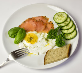 fried egg with salmon and vegetables