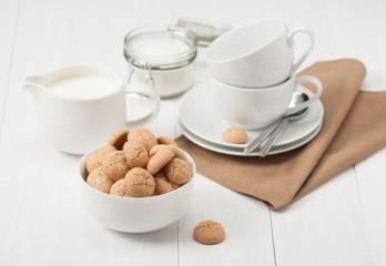 Amaretti Biscuits. Kitchenware. White Wooden Table