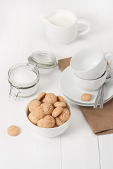 Amaretti Biscuits. Kitchenware. White Wooden Table