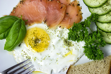 fried egg with salmon and vegetables