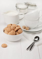 Amaretti Biscuits. Kitchenware. White Wooden Table